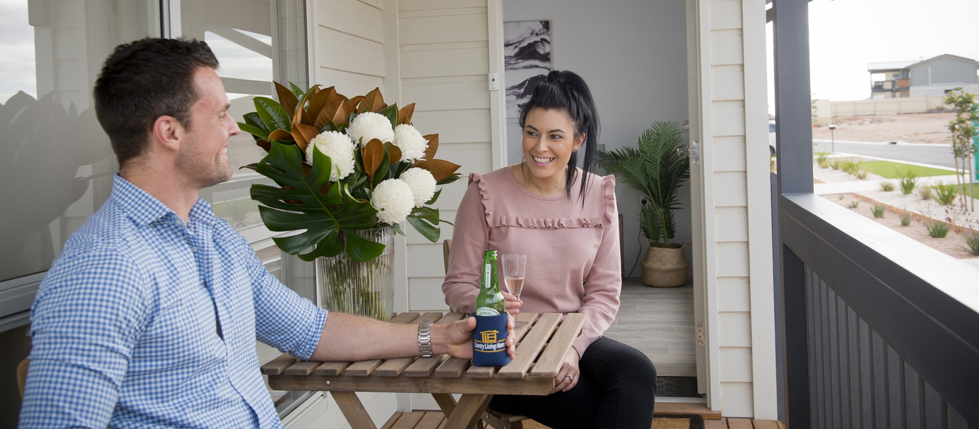A man and a woman having drinks as model photo